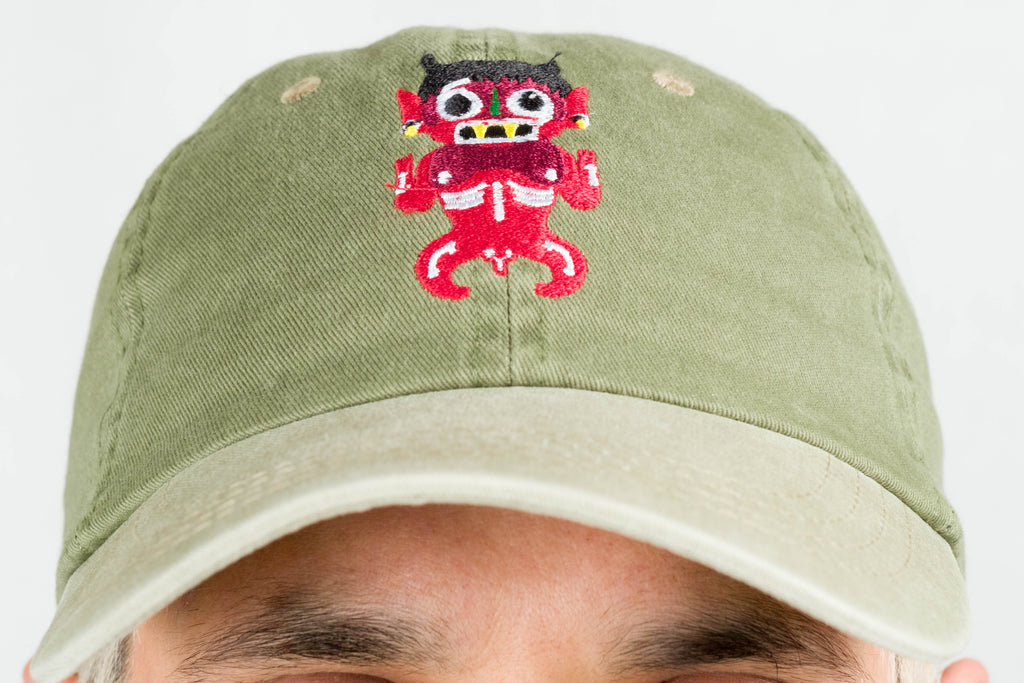 green dad hat xochipilli BORN IN 69