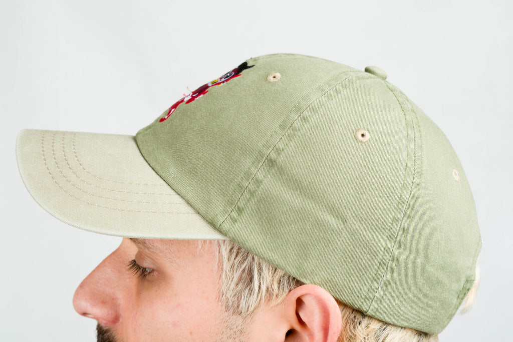 green dad hat xochipilli BORN IN 69